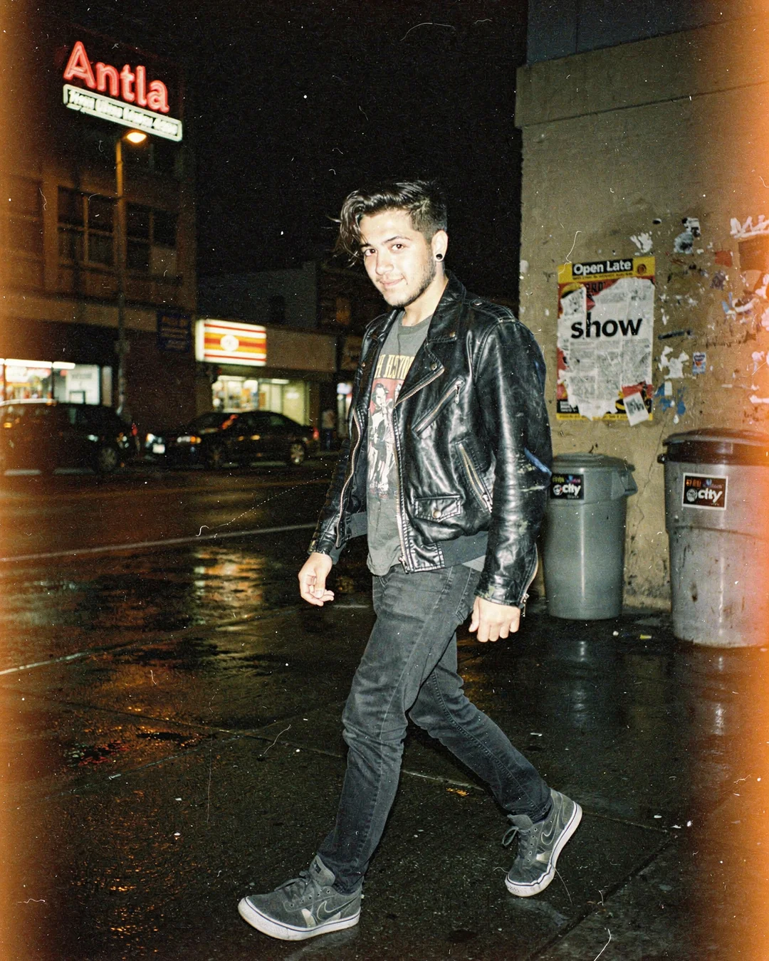 Night city flash fashion photo with neon reflections, representing AI try-on for paid social, email, and pre-order campaigns