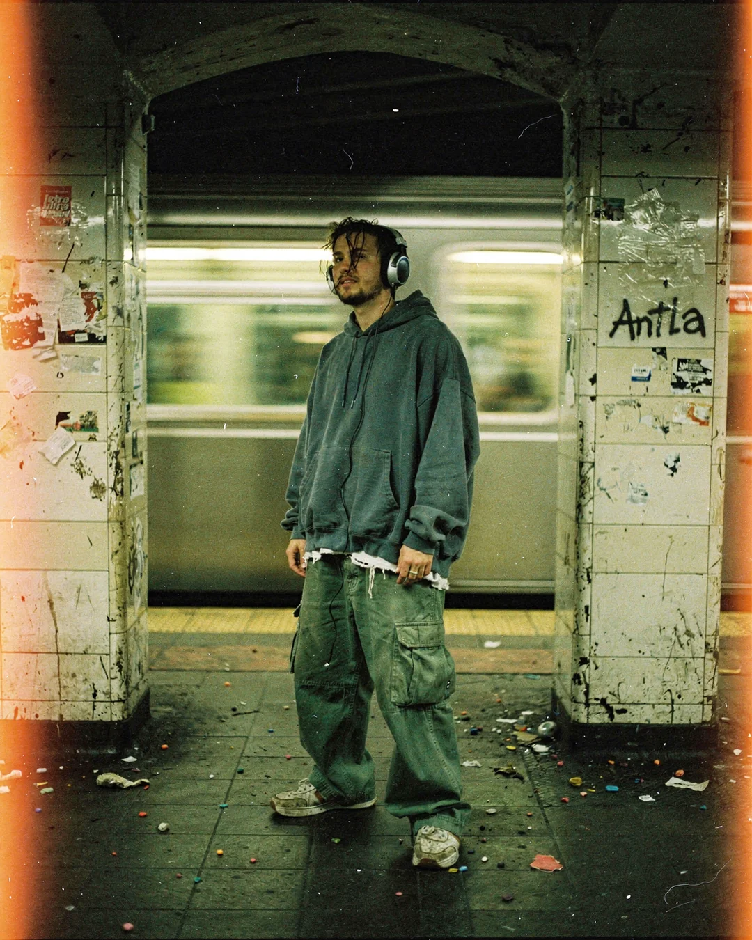 Subway platform streetwear photo with oversized fit and real-body context, illustrating why size charts fail Shopify fashion brands