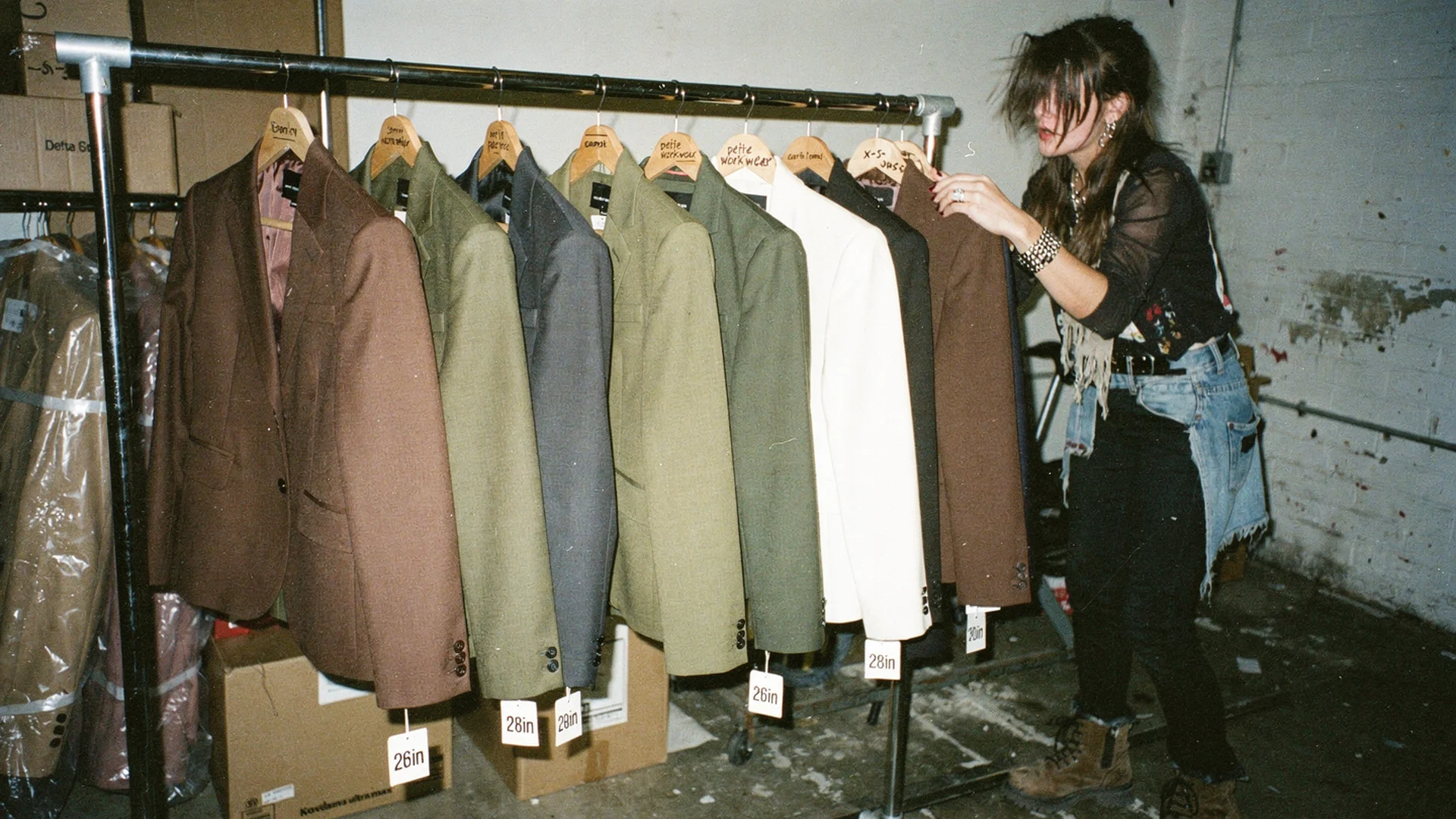 Curated rack of niche fashion apparel with distinct silhouettes, illustrating how to choose a fashion niche for AI-era ecommerce