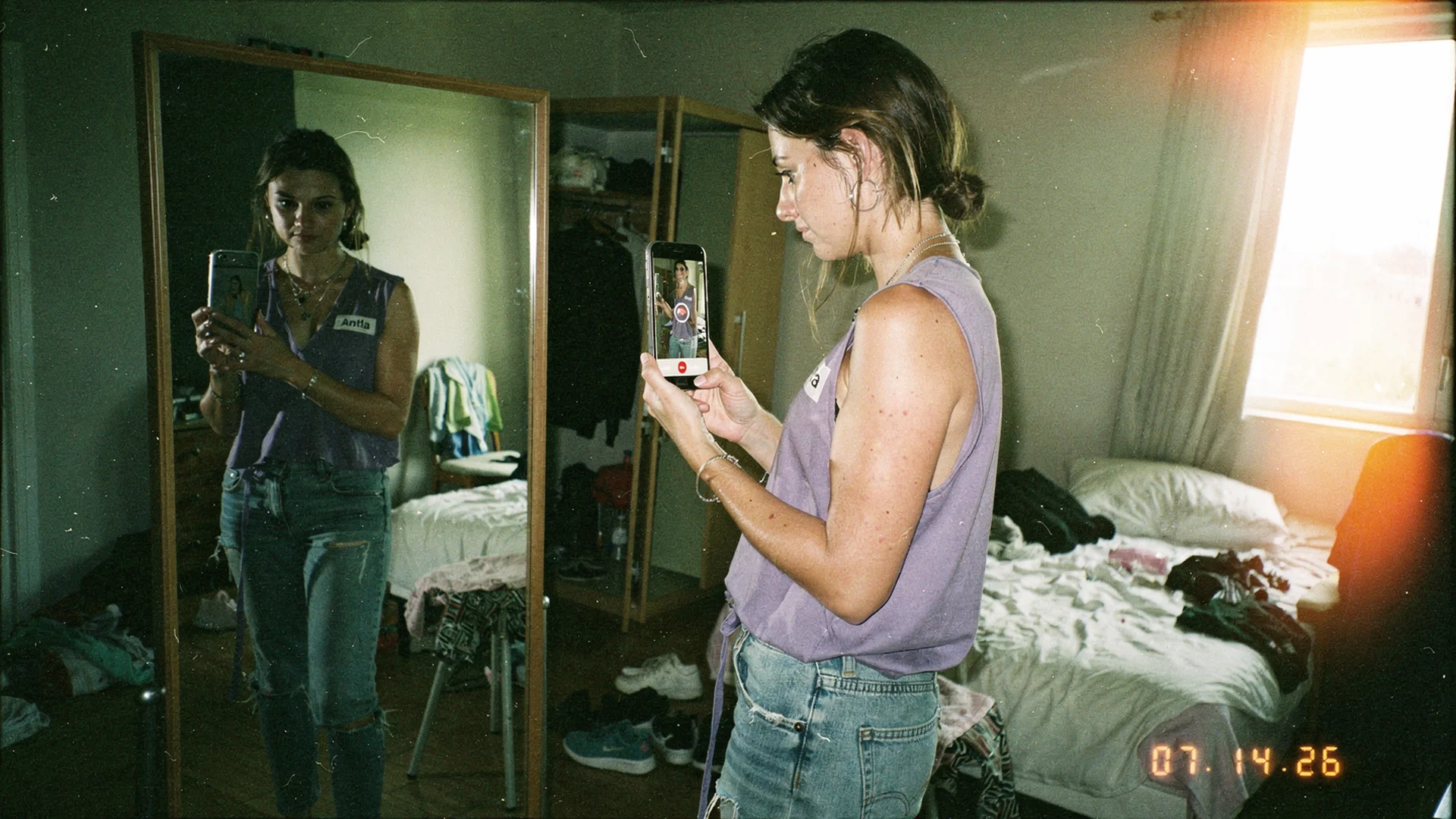 Shopper using virtual try-on on a phone to preview a dress on themselves, showing fit confidence for growing fashion brands