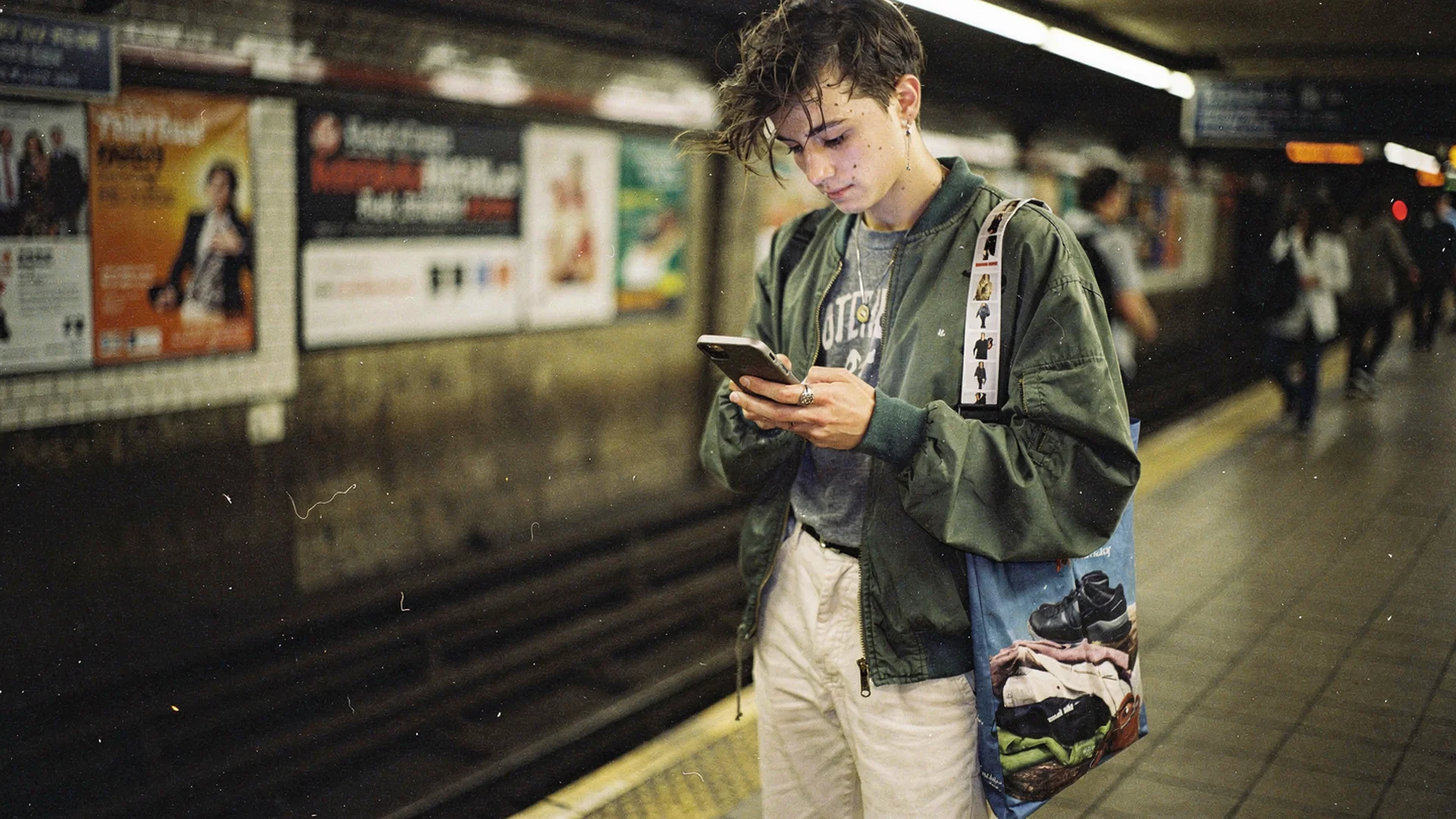 Shopper using an AI styling assistant on mobile to build an outfit from a fashion ecommerce catalog