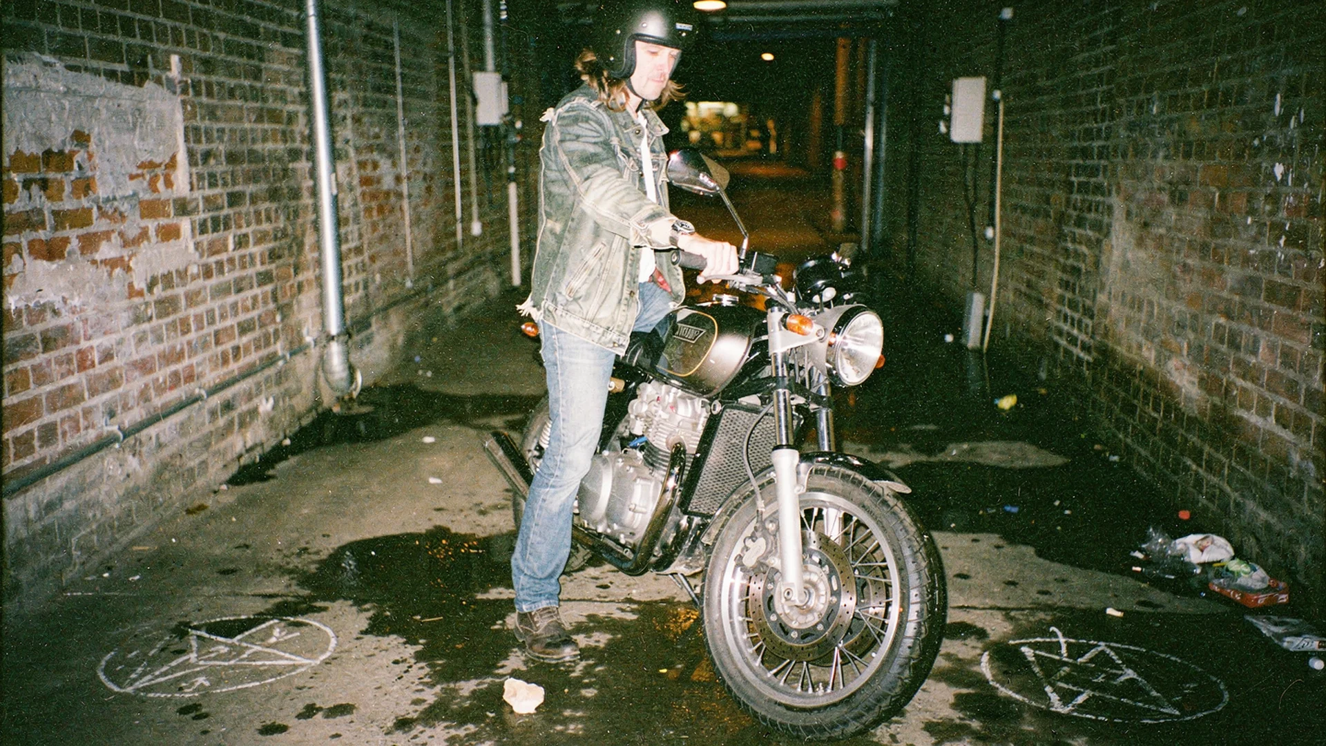 Motorcyclist previewing aftermarket handlebars and bar-end mirrors on their bike photo with virtual try-on on a Shopify product page