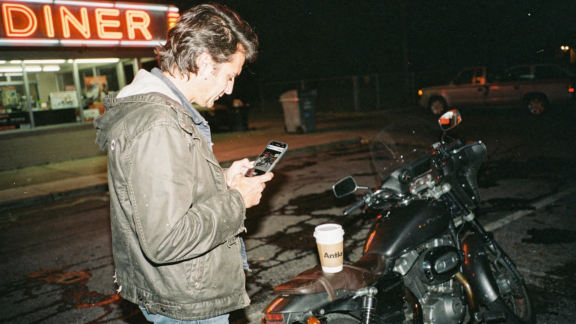 Motorcycle rider previewing leather saddlebags on their bike photo with virtual try-on on a Shopify powersports product page