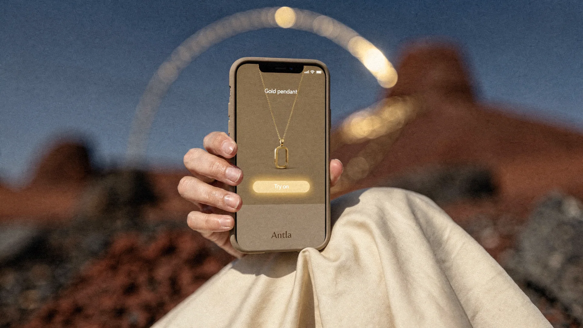 Shopper comparing hoop earring virtual try-on on phone with skin tone and scale visible next to Shopify jewelry product page on laptop