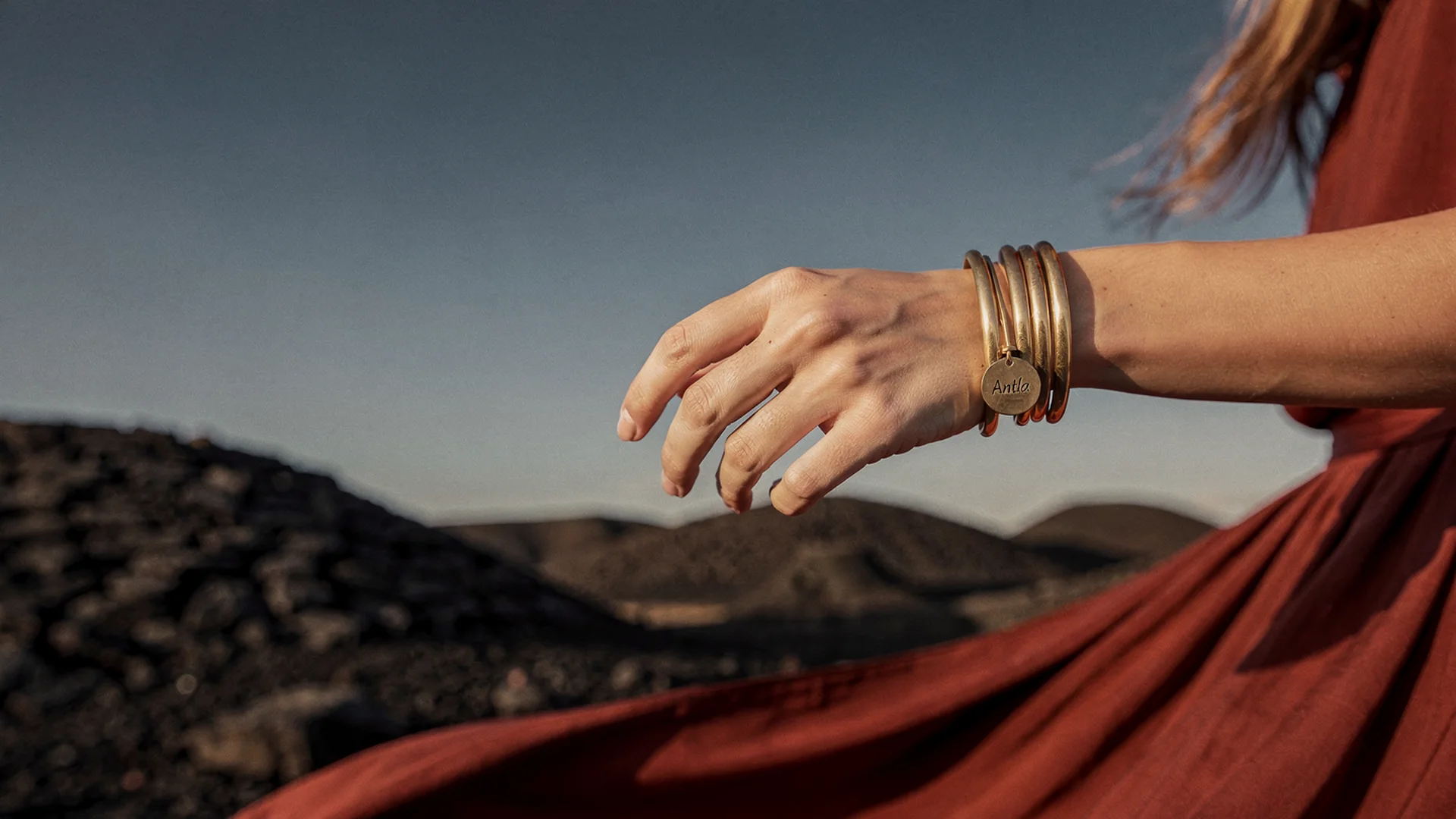 Virtual try-on preview of stackable rings and bracelets layered on shopper hand and wrist photos on Shopify