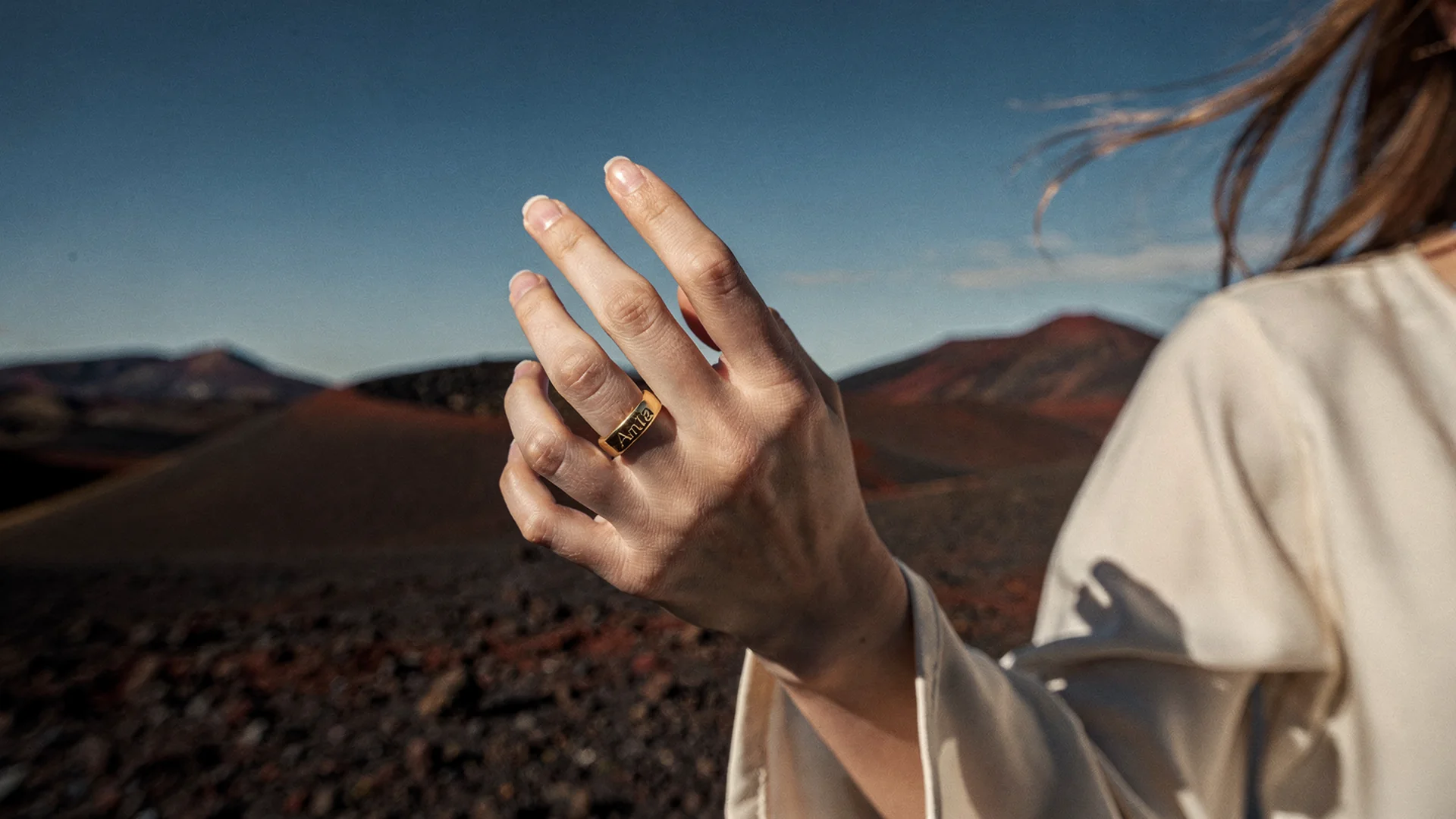 Shopper previewing a gemstone ring on their hand using virtual try-on on a Shopify jewelry product page