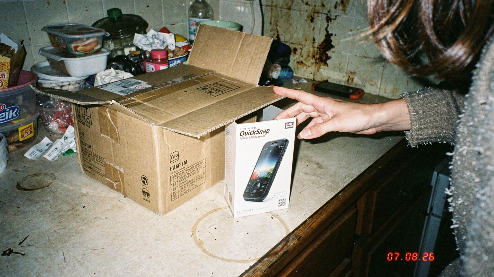 Shopper holding a returned dress beside a laptop showing the original product page expectation