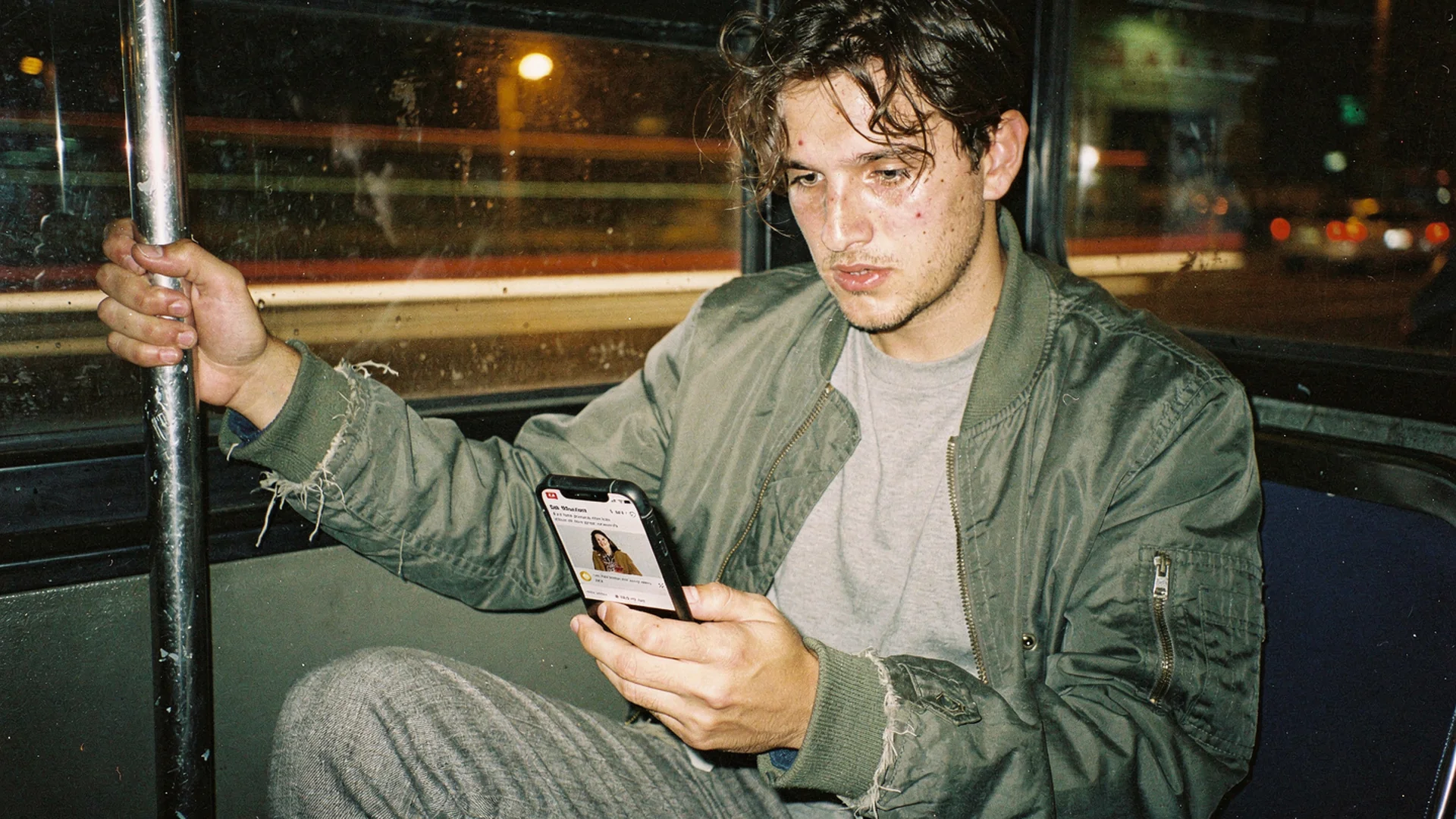 Fashion marketer on a night bus reading a re-engagement email with a personalized virtual try-on thumbnail
