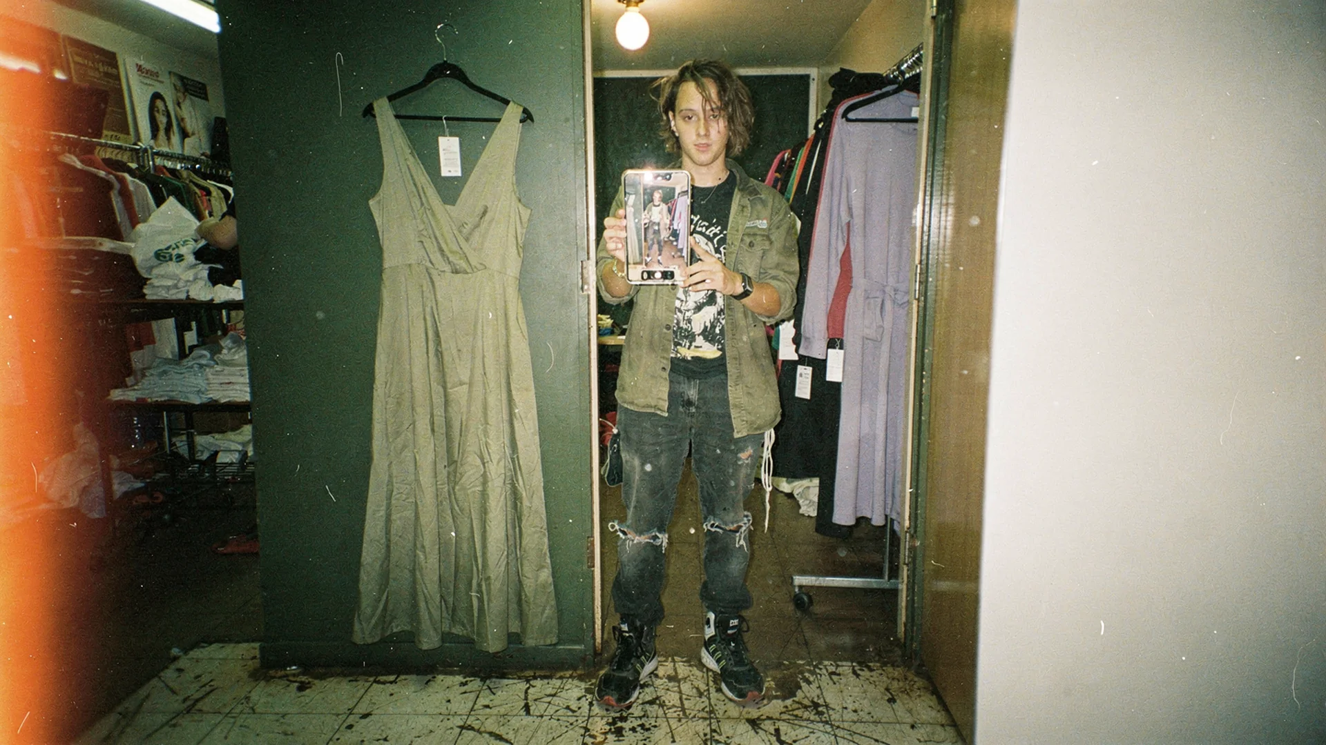 Disposable-camera Antla editorial: merchandiser comparing model photos, fit charts, and a shopper try-on preview on one desk